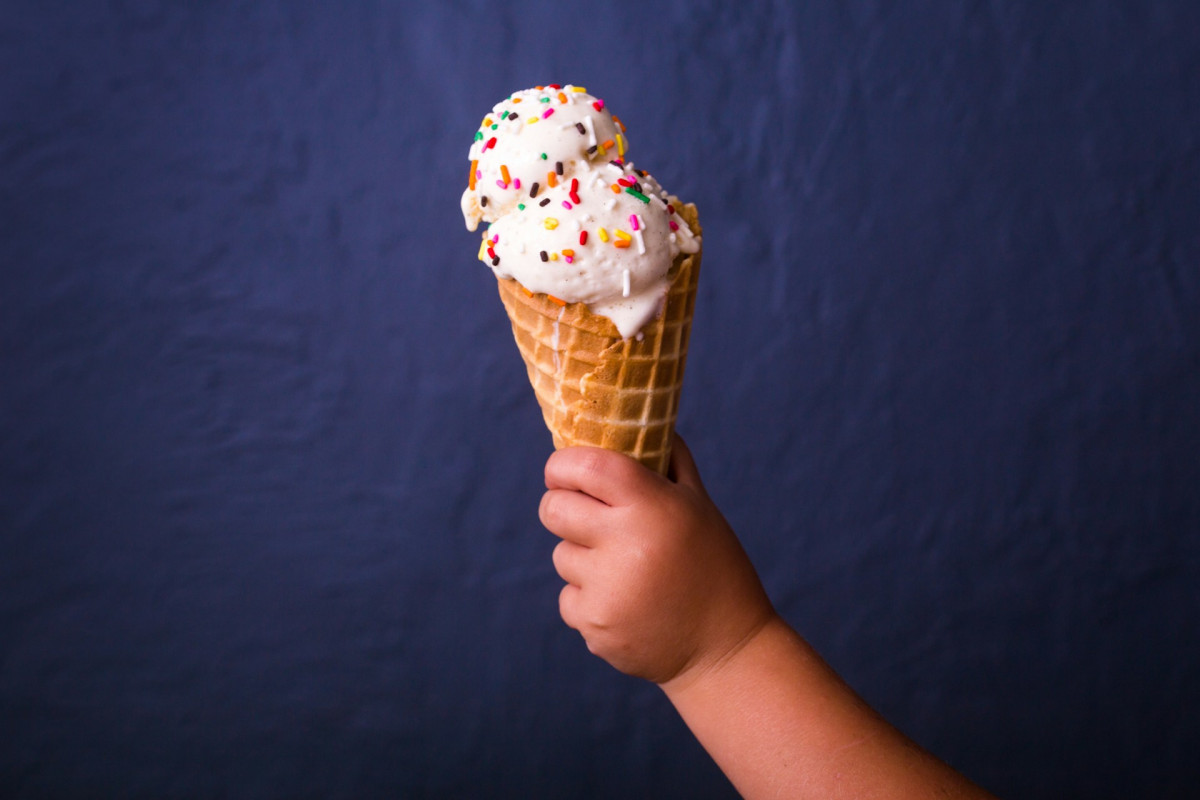 child holding ice cream